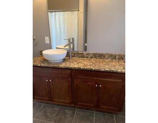 205 Podunk Road Sturbridge, MA 01566 - Photo 14 of 30 a bathroom with a granite countertop sink and a mirror