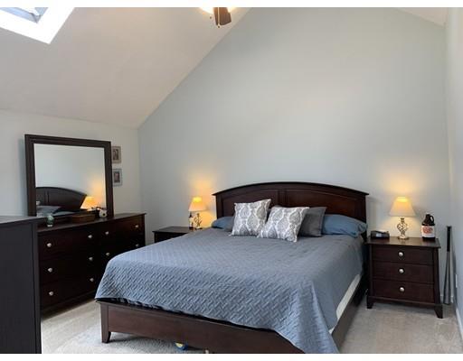 205 Podunk Road Sturbridge, MA 01566 - Photo 16 of 30 a bedroom with a bed and a dresser