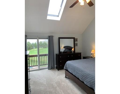 205 Podunk Road Sturbridge, MA 01566 - Photo 17 of 30 a bedroom with a bed and a tv