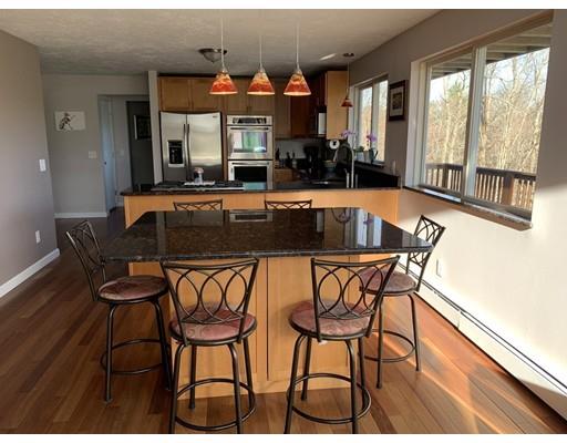 205 Podunk Road Sturbridge, MA 01566 - Photo 2 of 30 a view of a dining room with furniture and a large window