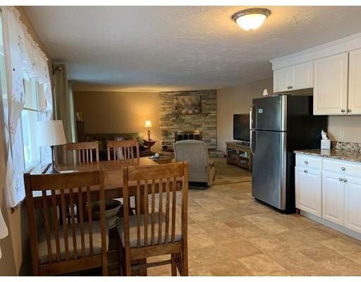 205 Podunk Road Sturbridge, MA 01566 - Photo 24 of 30 a kitchen with refrigerator and chairs