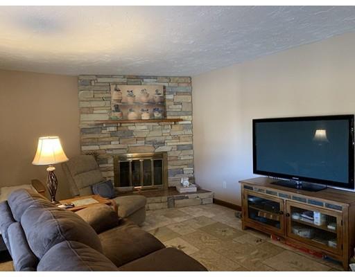 205 Podunk Road Sturbridge, MA 01566 - Photo 25 of 30 a living room with furniture and a flat screen tv