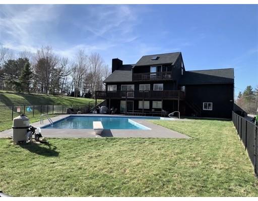 205 Podunk Road Sturbridge, MA 01566 - Photo 28 of 30 a front view of a house with a yard