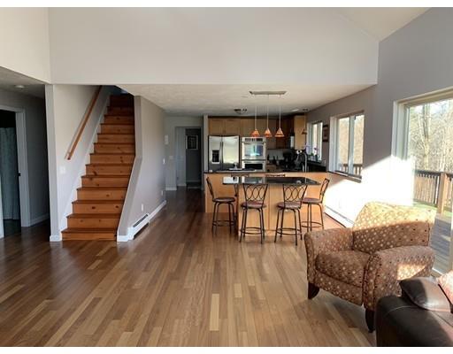 205 Podunk Road Sturbridge, MA 01566 - Photo 3 of 30 a living room with furniture and a wooden floor