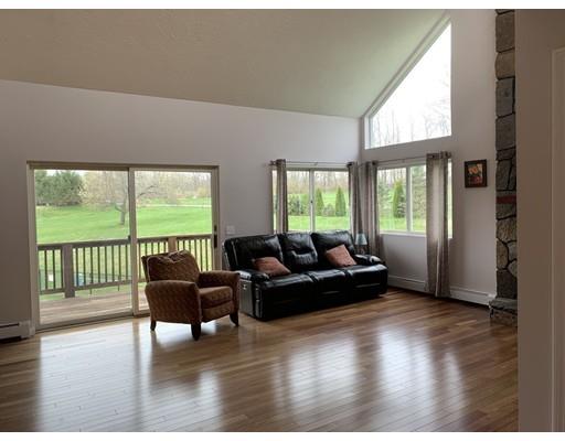 205 Podunk Road Sturbridge, MA 01566 - Photo 8 of 30 a living room with furniture and a large window
