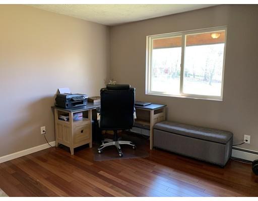 205 Podunk Road Sturbridge, MA 01566 - Photo 9 of 30 a view of a workspace with furniture and a window