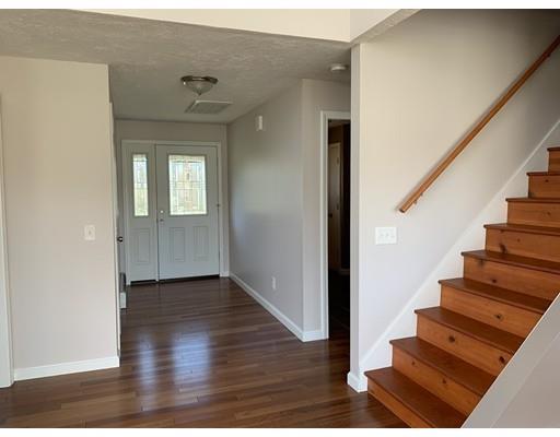 205 Podunk Road Sturbridge, MA 01566 - Photo 10 of 30 a view interior of a house with wooden floor and windows