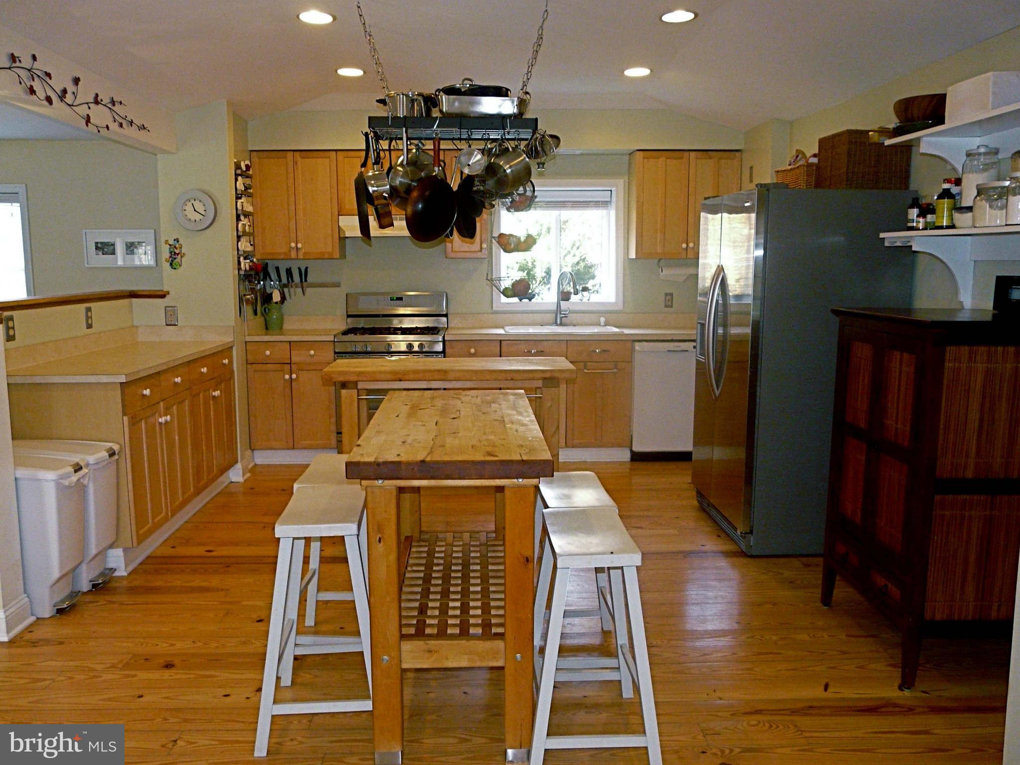 3009 Paper Mill Road Phoenix, MD 21131 - Photo 17 of 30 a kitchen with stainless steel appliances granite countertop a sink and a refrigerator