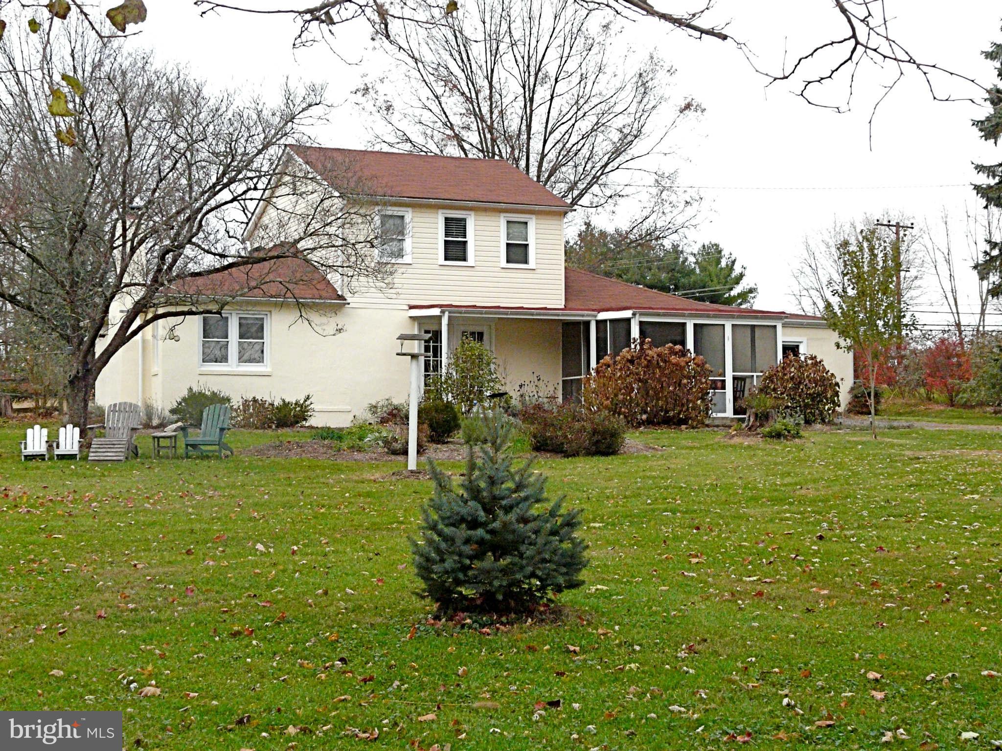 3009 Paper Mill Road Phoenix, MD 21131 - Photo 4 of 30 a house that is sitting in the grass with large trees