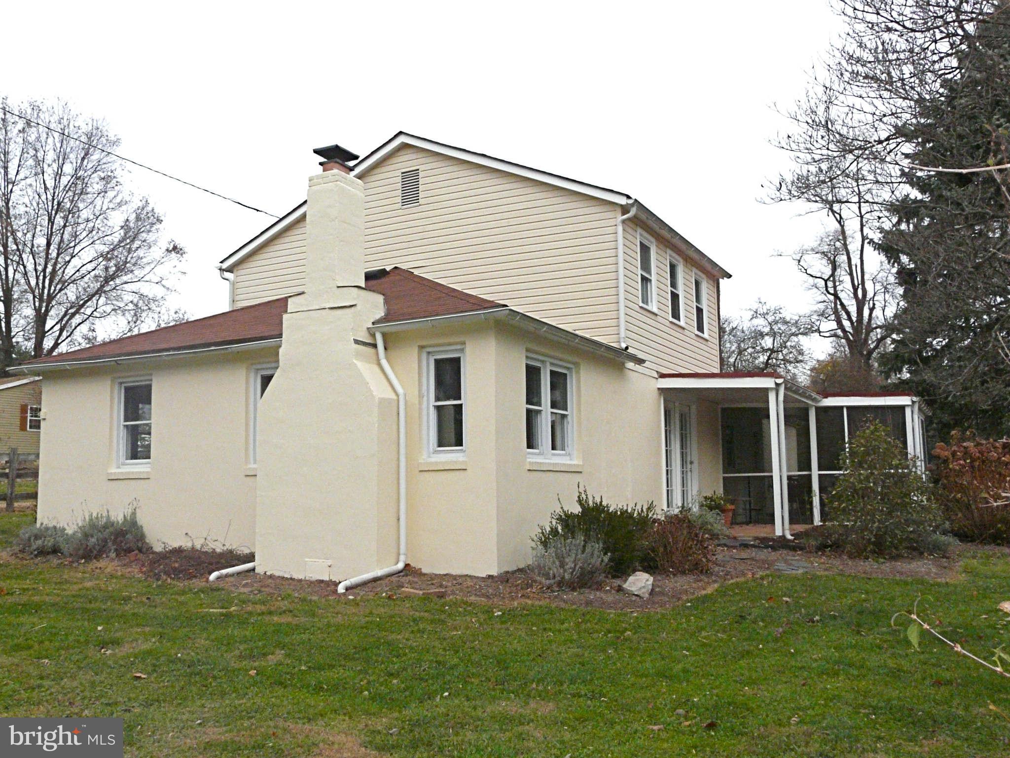 3009 Paper Mill Road Phoenix, MD 21131 - Photo 5 of 30 a front view of a house with a yard