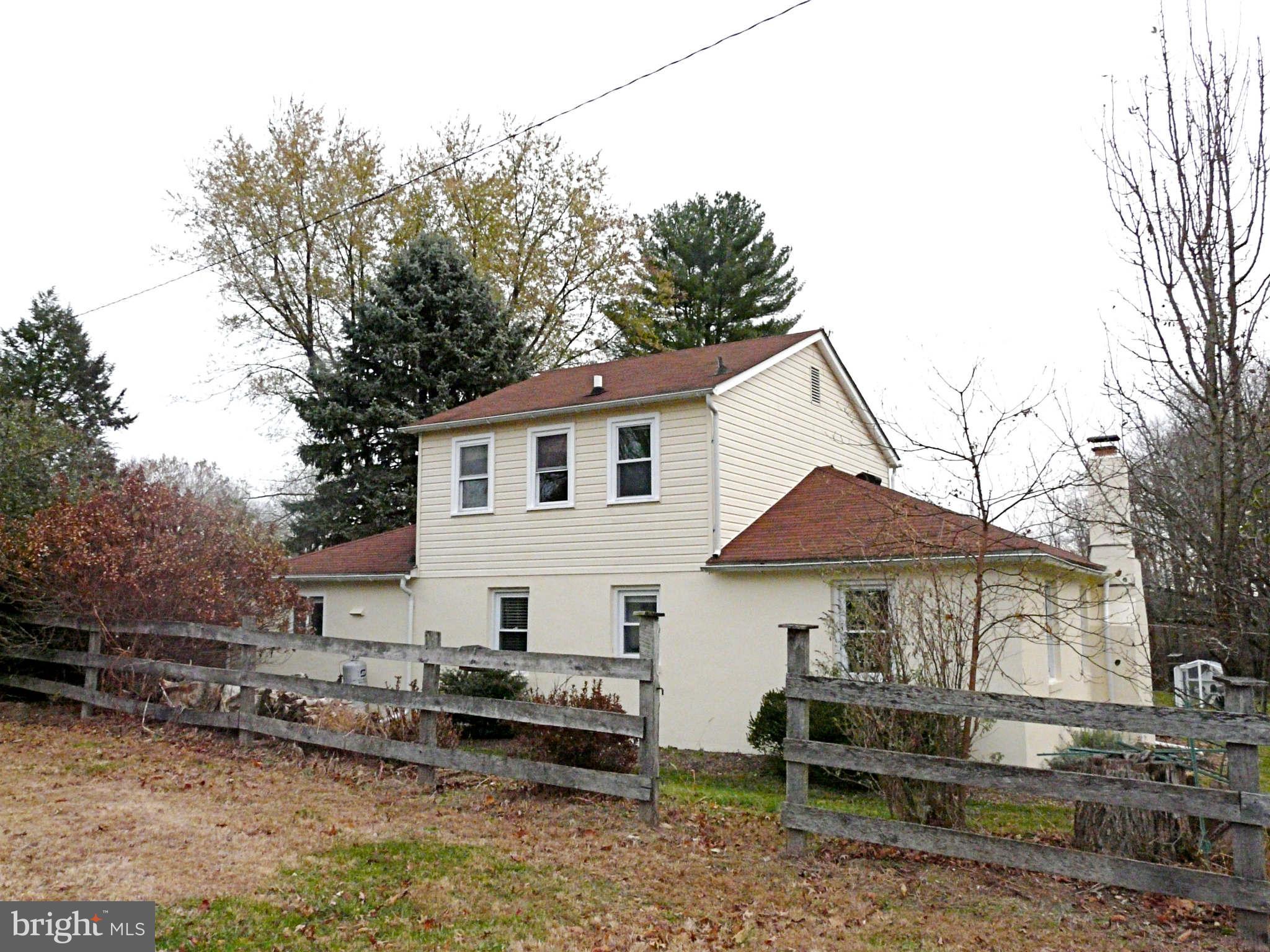 3009 Paper Mill Road Phoenix, MD 21131 - Photo 6 of 30 a view of a white house with a yard and sitting area