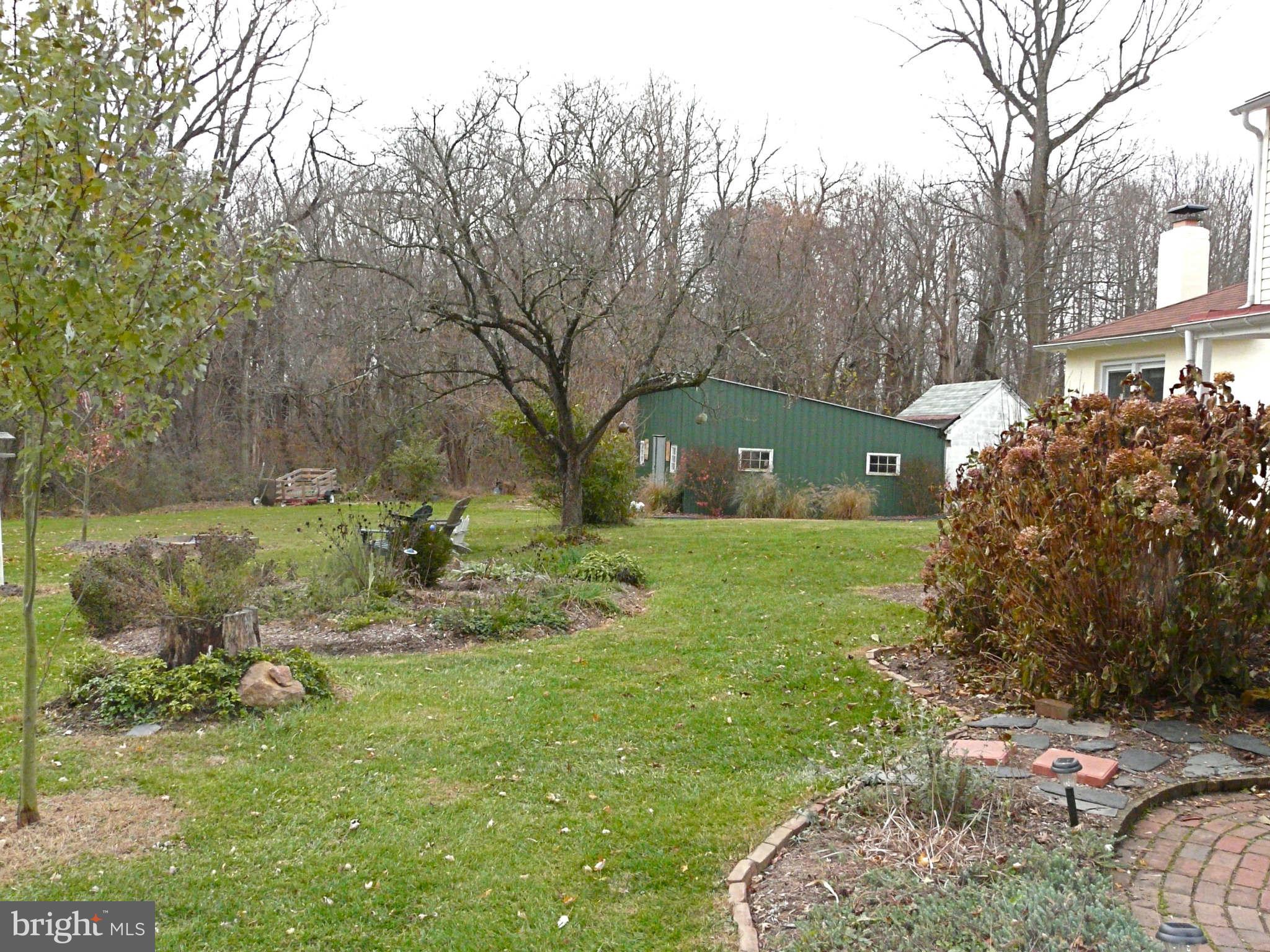 3009 Paper Mill Road Phoenix, MD 21131 - Photo 7 of 30 a view of a garden with a slide