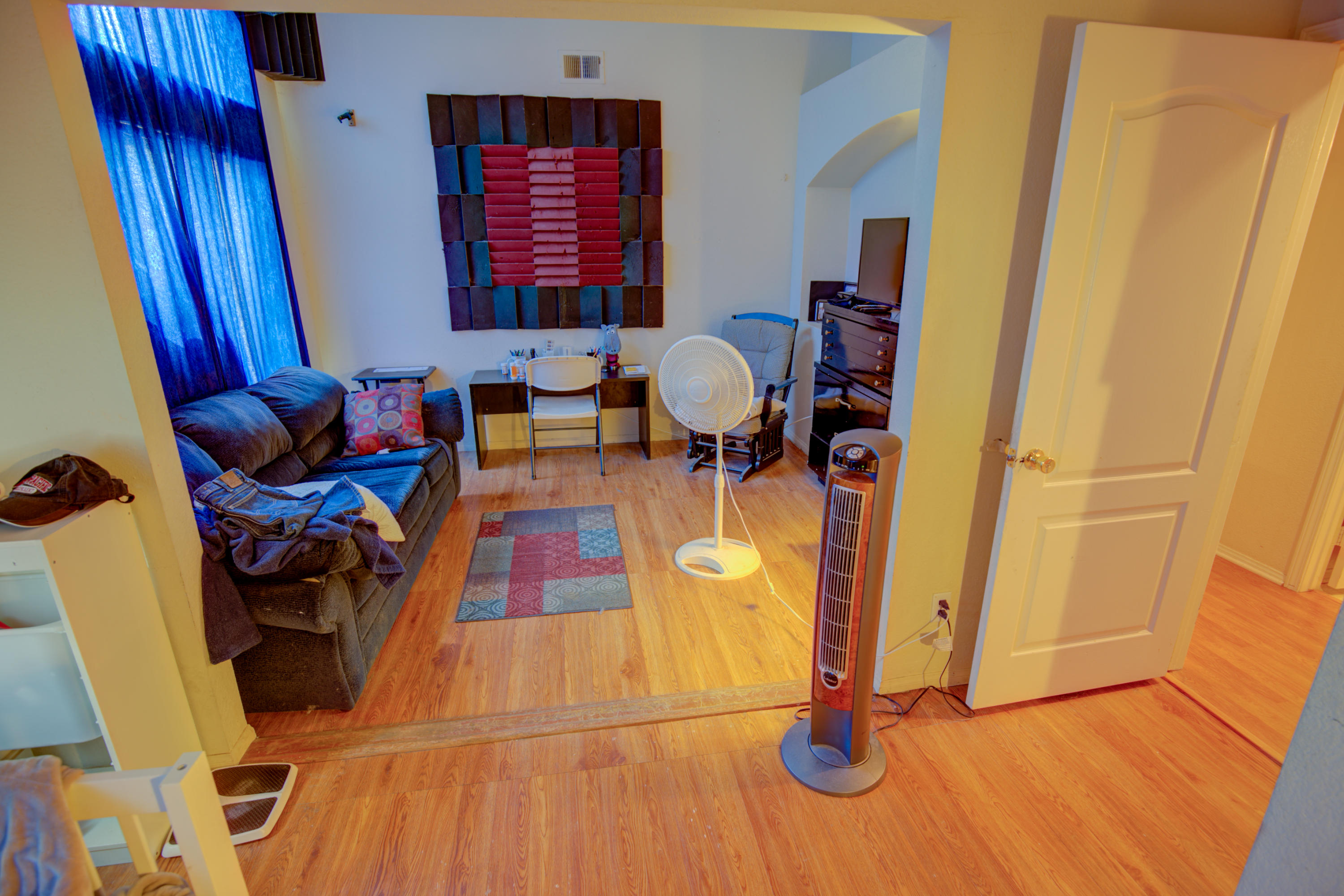 3050 Quarry Road Palmdale, CA 93550 - Photo 12 of 21 a view of living room with furniture and gym equipment