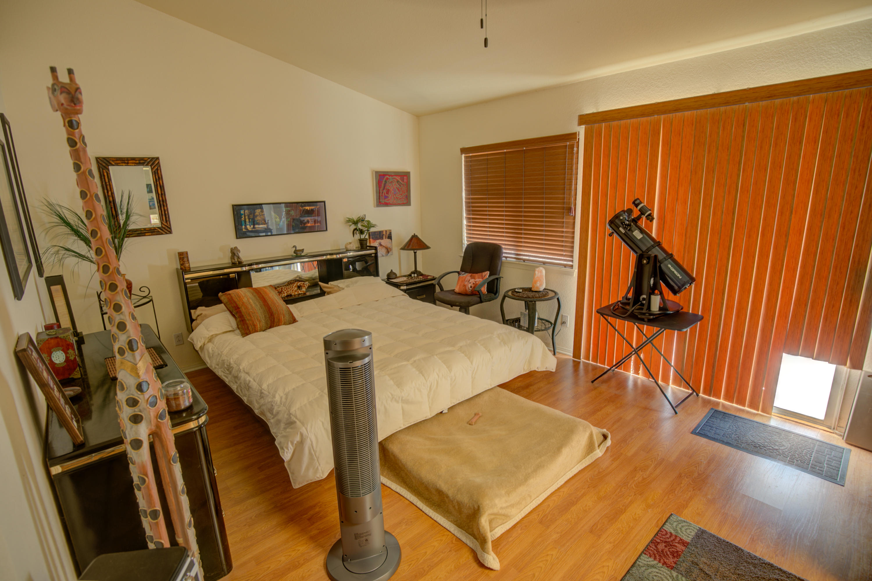 3050 Quarry Road Palmdale, CA 93550 - Photo 17 of 21 a living room with furniture a flat screen tv and a refrigerator