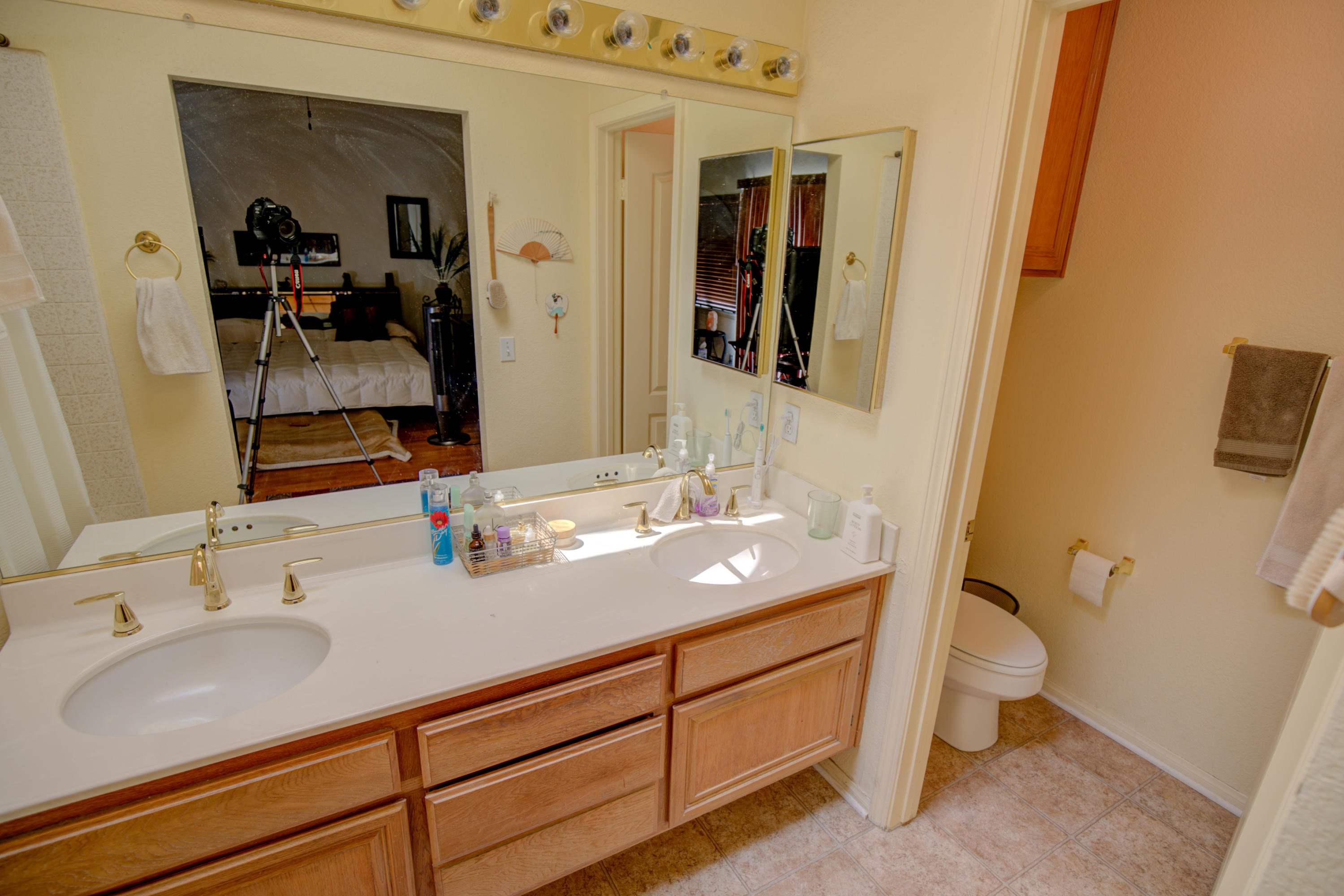 3050 Quarry Road Palmdale, CA 93550 - Photo 21 of 21 a bathroom with a sink and a mirror