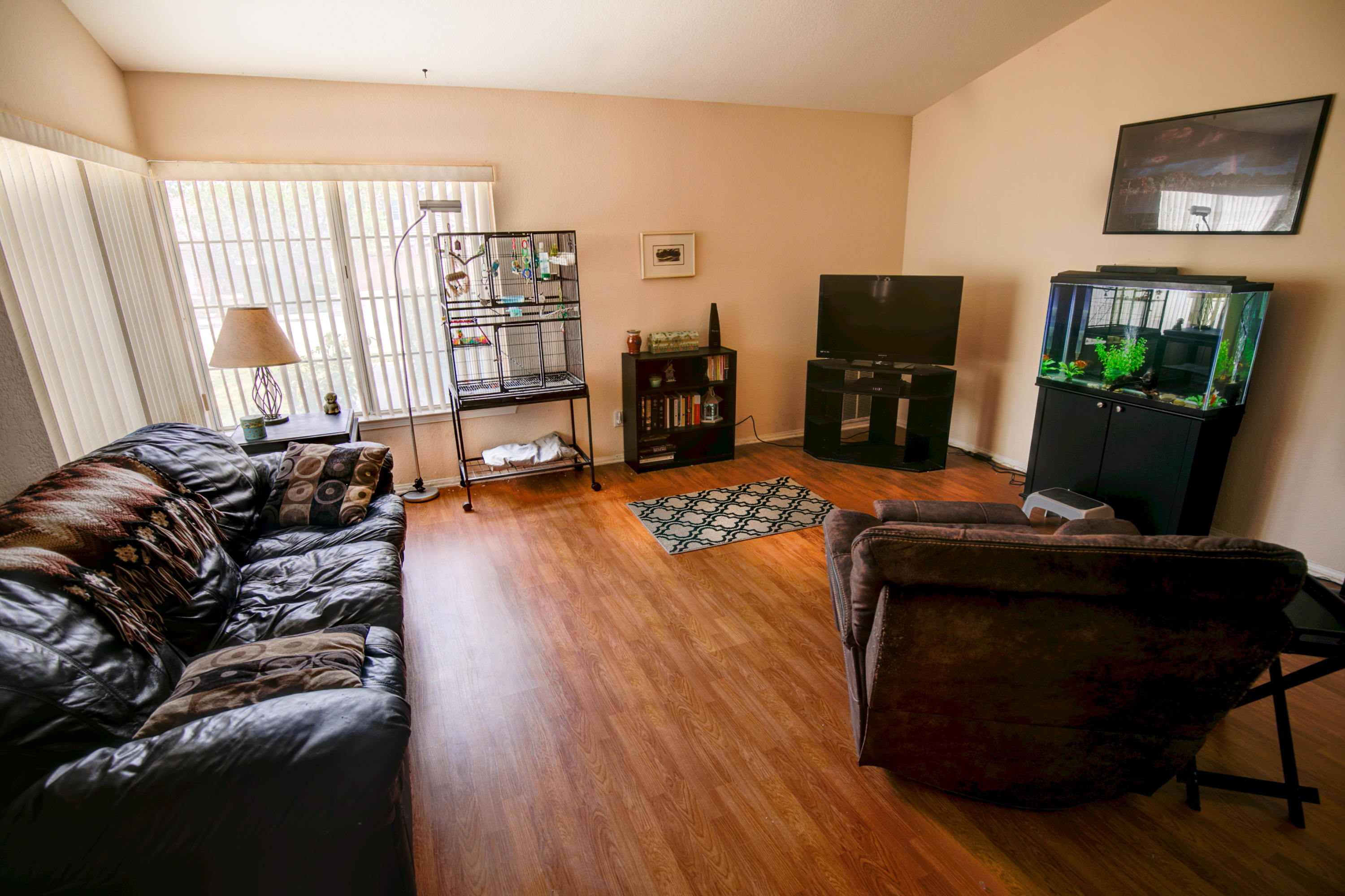 3050 Quarry Road Palmdale, CA 93550 - Photo 3 of 21 a living room with furniture and a flat screen tv