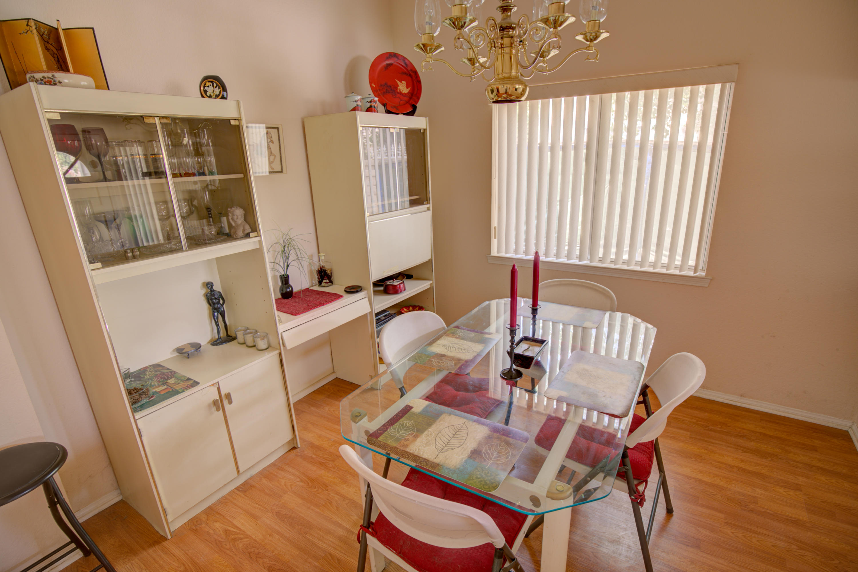 3050 Quarry Road Palmdale, CA 93550 - Photo 4 of 21 a view of a dining room with furniture window and wooden floor