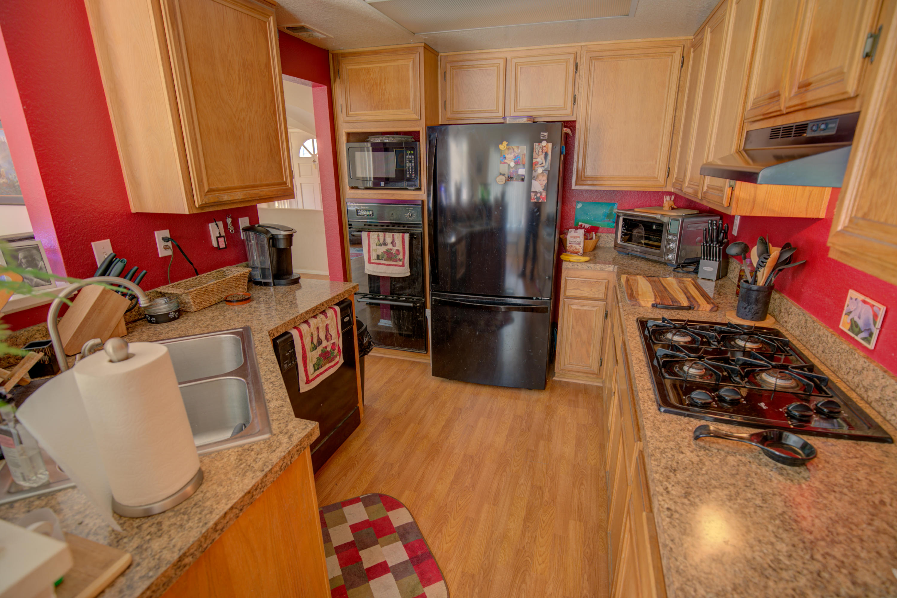 3050 Quarry Road Palmdale, CA 93550 - Photo 9 of 21 a kitchen with stainless steel appliances granite countertop a refrigerator and a stove