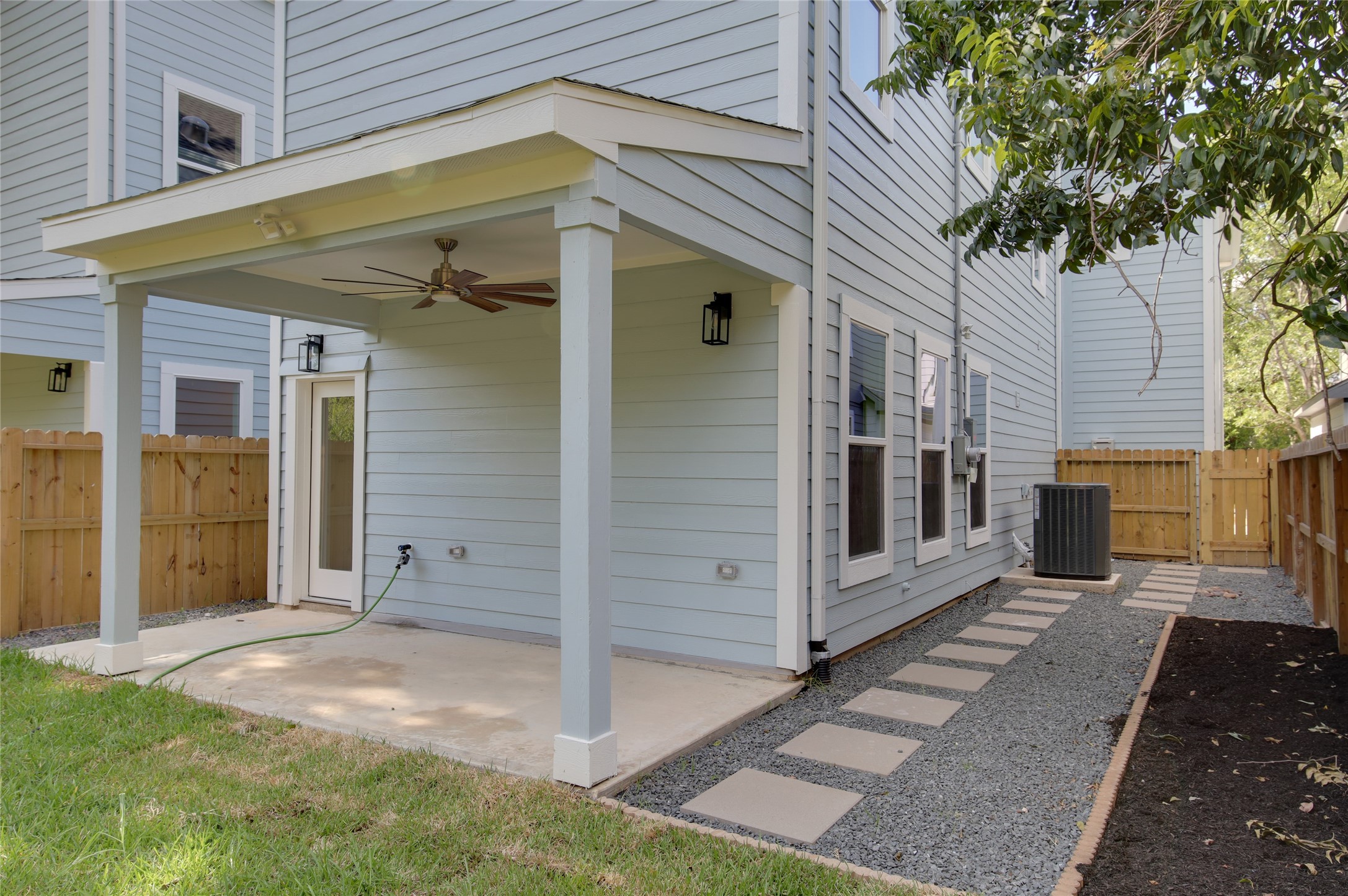 955 Ringold Street Houston, TX 77088 - Photo 19 of 48 a view of a house with backyard and wooden fence