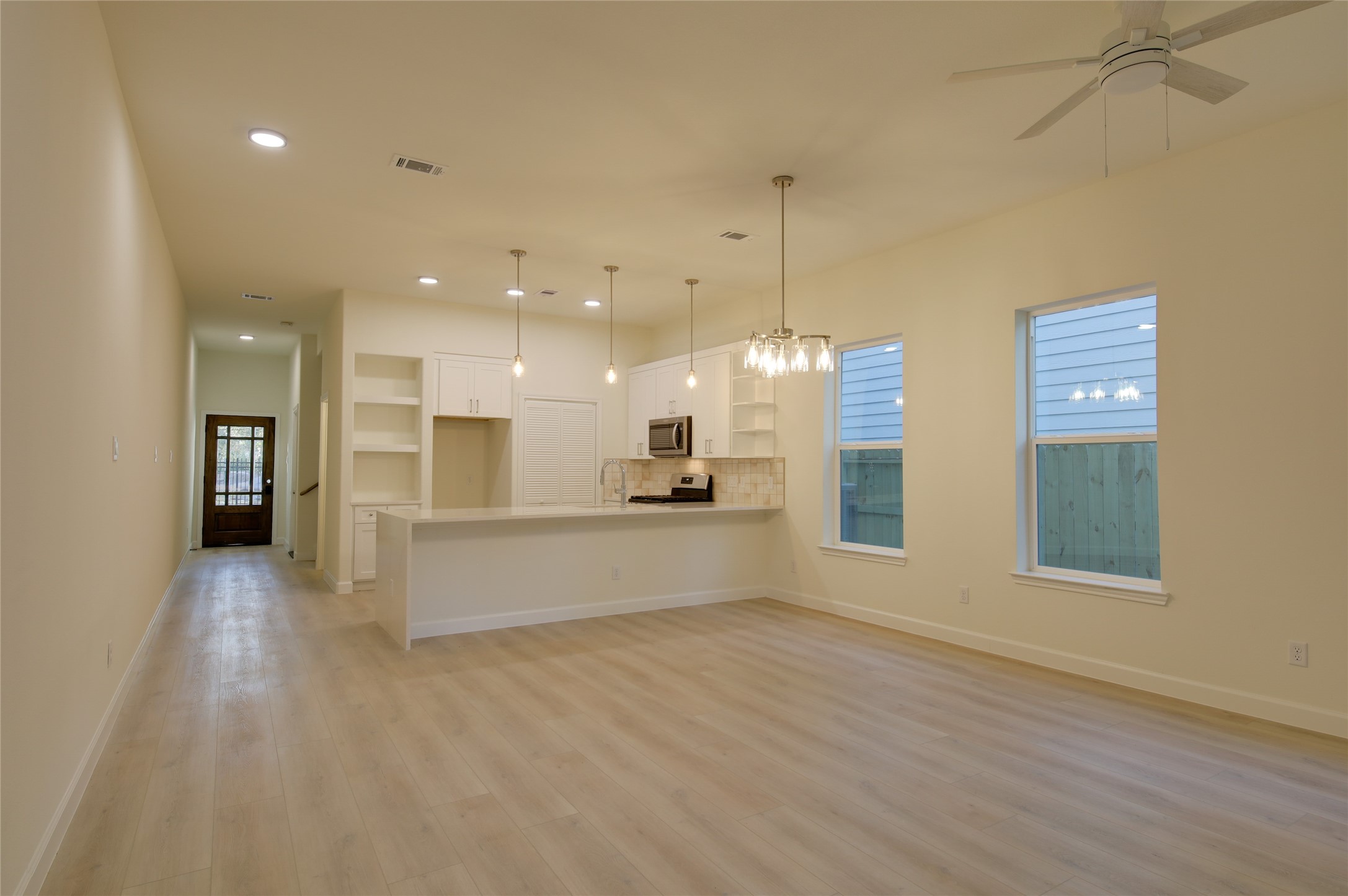 955 Ringold Street Houston, TX 77088 - Photo 22 of 48 a large space with kitchen island and stainless steel appliances