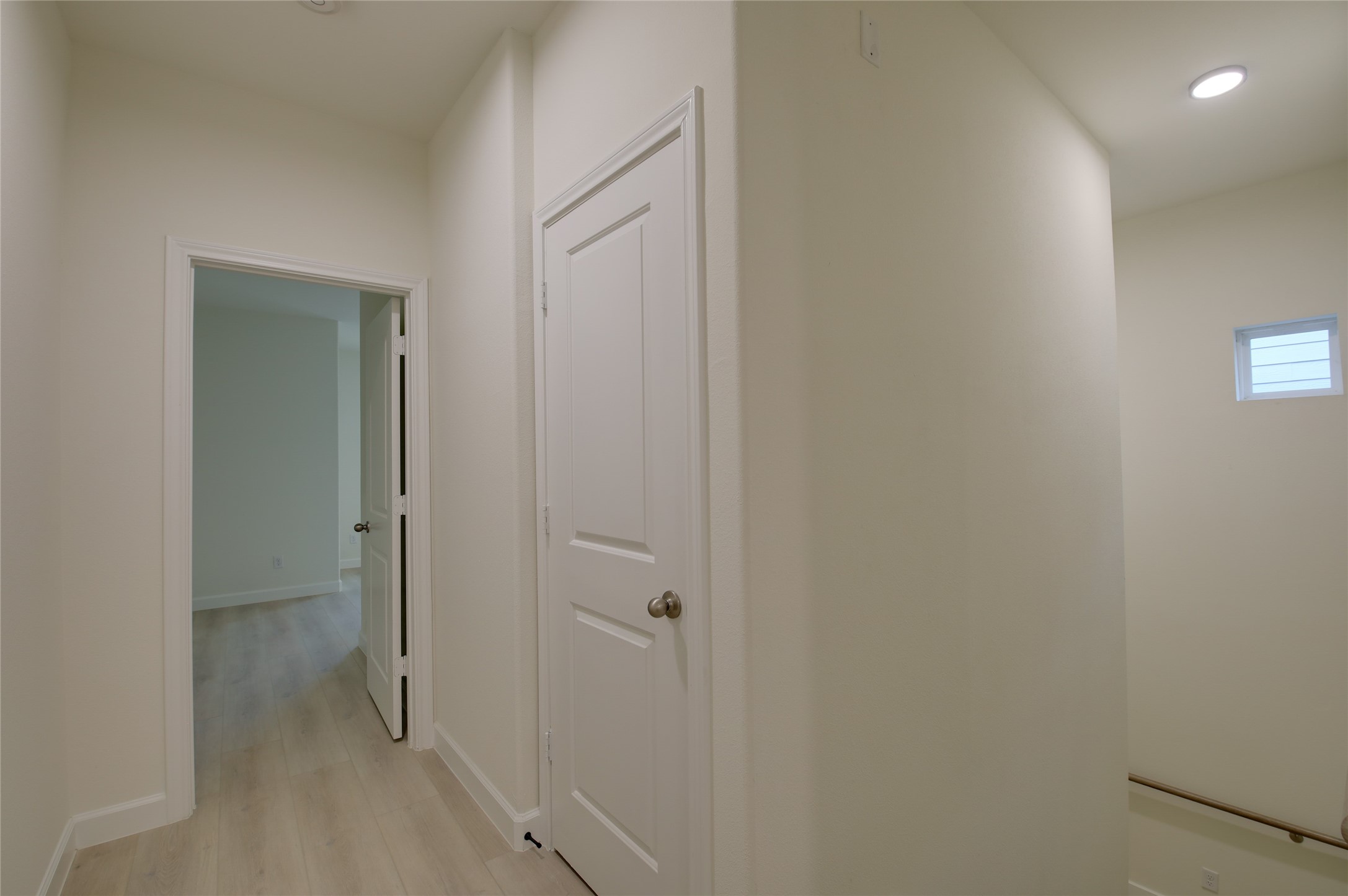 955 Ringold Street Houston, TX 77088 - Photo 24 of 48 a view of a hallway with closet and wooden floor
