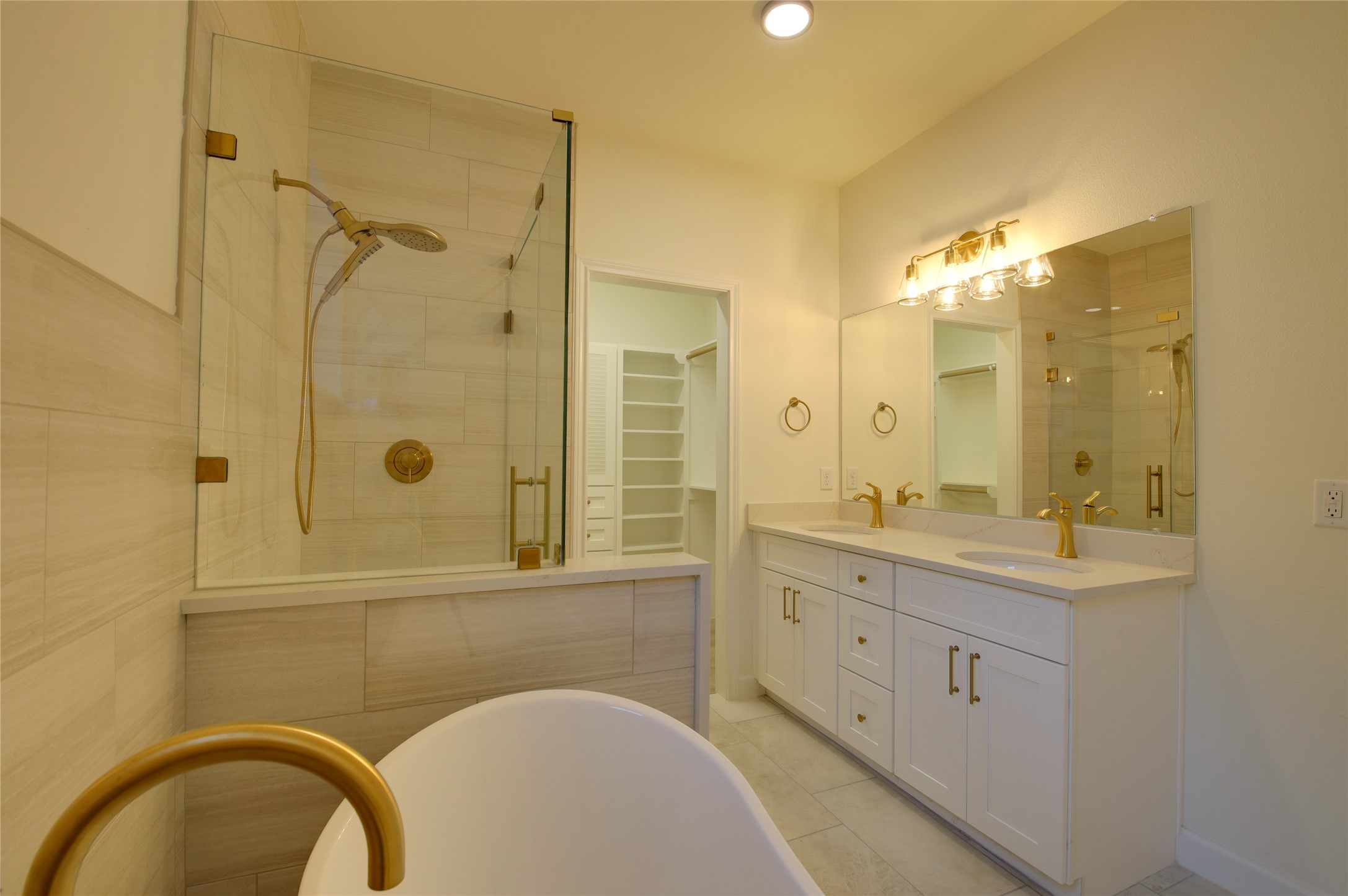 955 Ringold Street Houston, TX 77088 - Photo 29 of 48 a bathroom with a granite countertop sink a mirror and shower