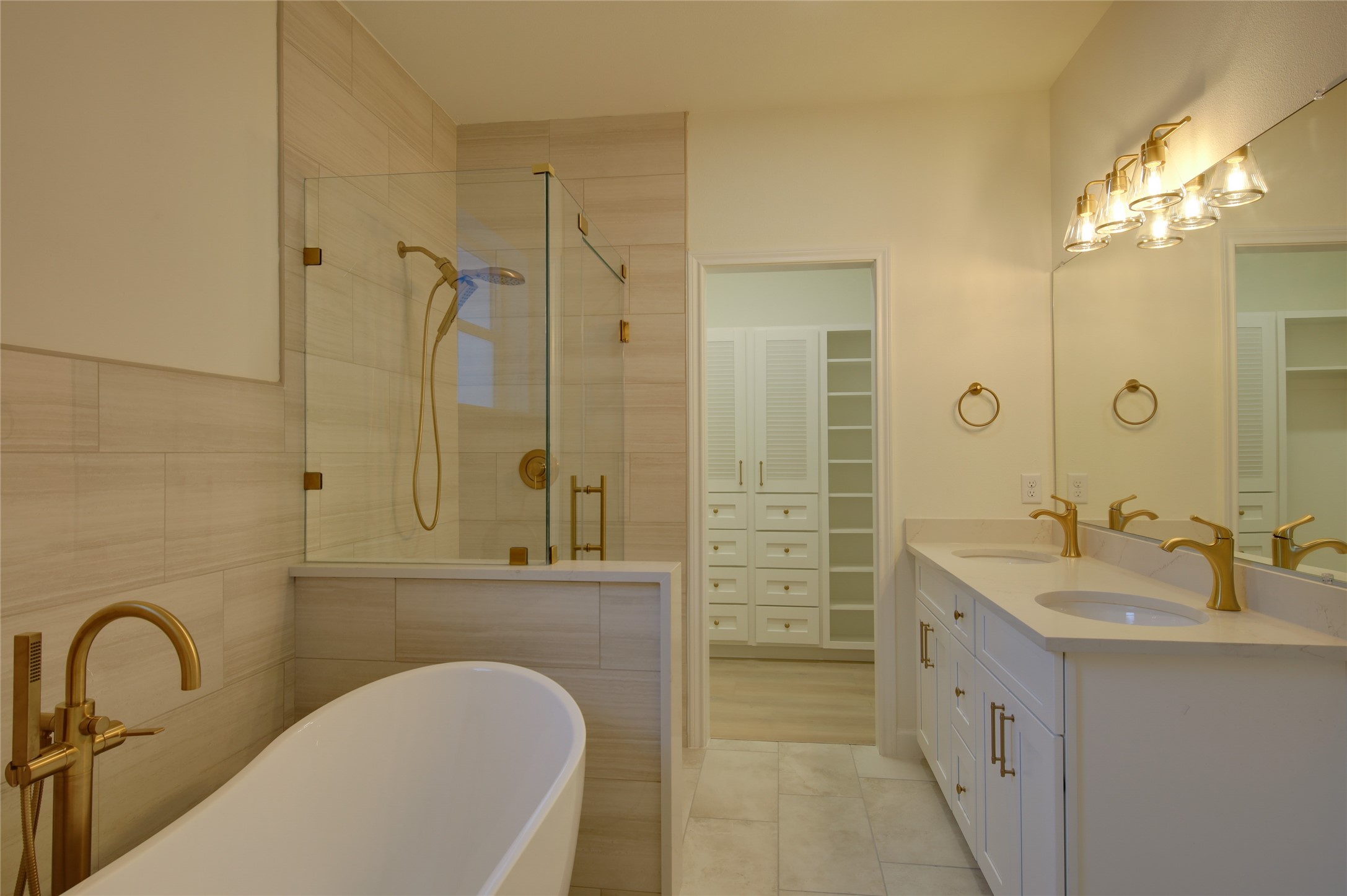 955 Ringold Street Houston, TX 77088 - Photo 30 of 48 a bathroom with a double vanity sink a mirror and a shower