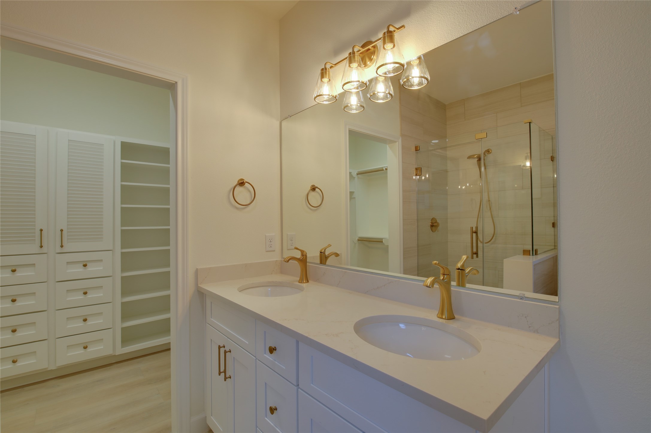 955 Ringold Street Houston, TX 77088 - Photo 31 of 48 a bathroom with a granite countertop sink a mirror and a shower