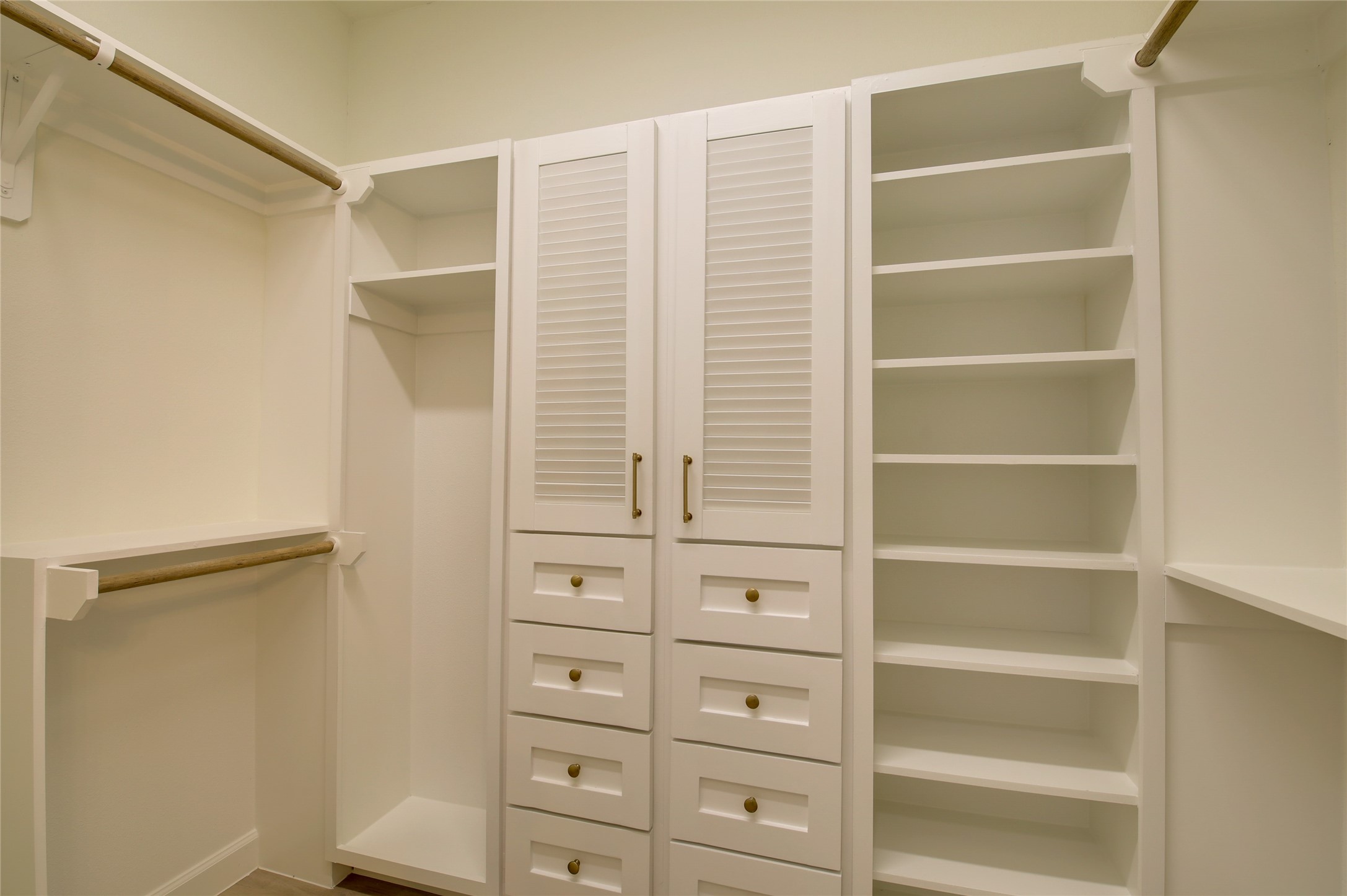 955 Ringold Street Houston, TX 77088 - Photo 32 of 48 a view of walk in closet with empty racks
