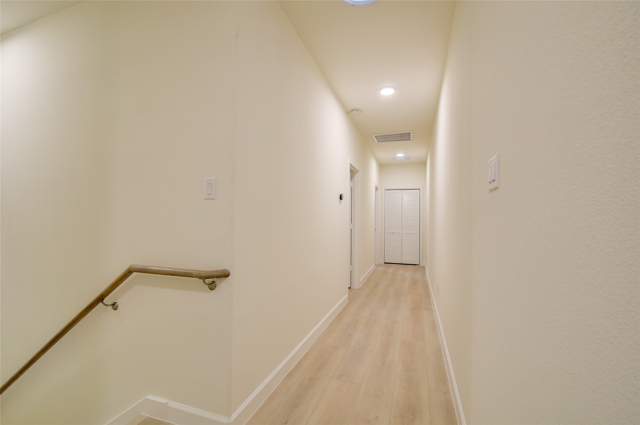 955 Ringold Street Houston, TX 77088 - Photo 34 of 48 a view of a hallway with wooden floor