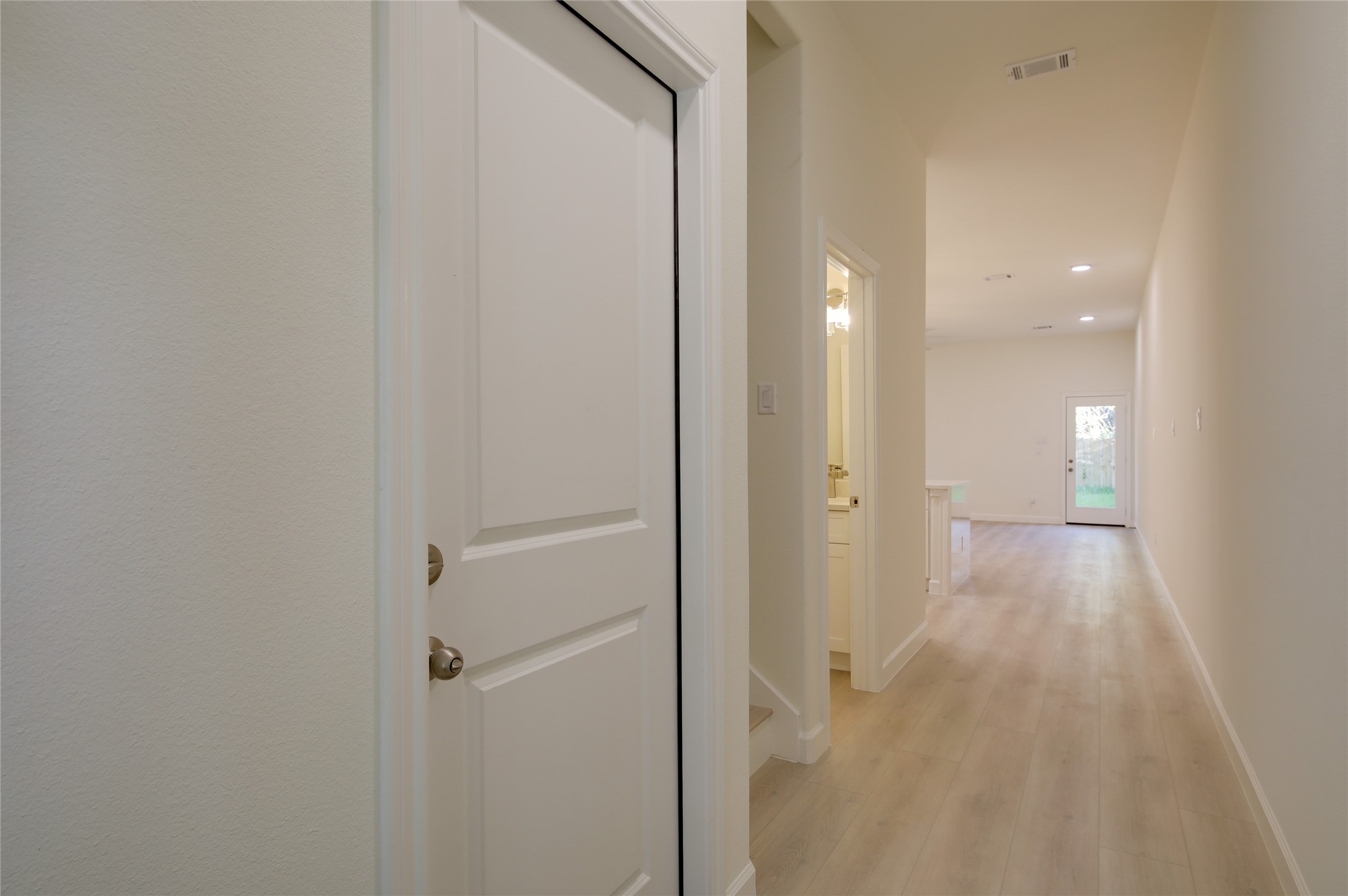 955 Ringold Street Houston, TX 77088 - Photo 7 of 48 a view of a hallway with wooden floor