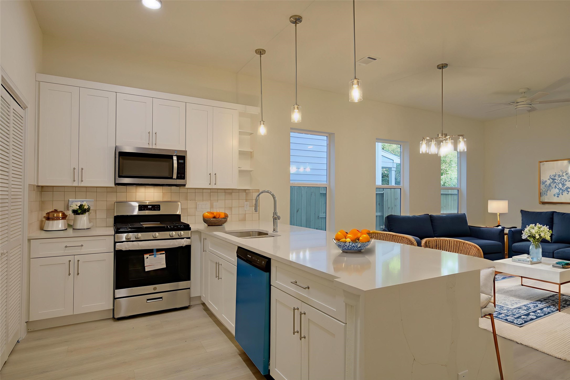 955 Ringold Street Houston, TX 77088 - Photo 8 of 48 a kitchen with stainless steel appliances granite countertop a sink a stove and a wooden floors