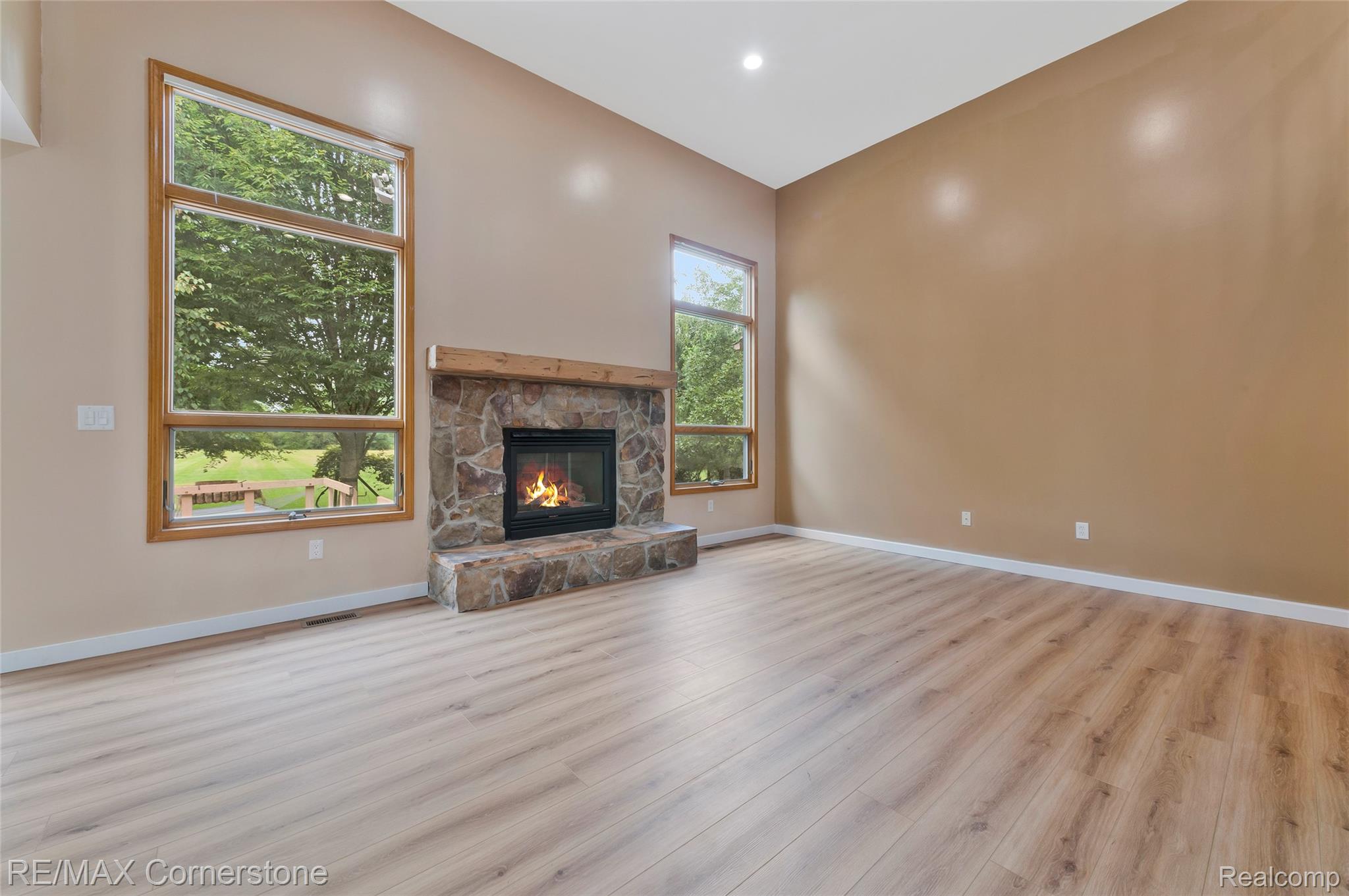 12701 Capernall Road Carleton, MI 48117 - Photo 9 of 62 Living Room with lots of natural light and a fireplace
