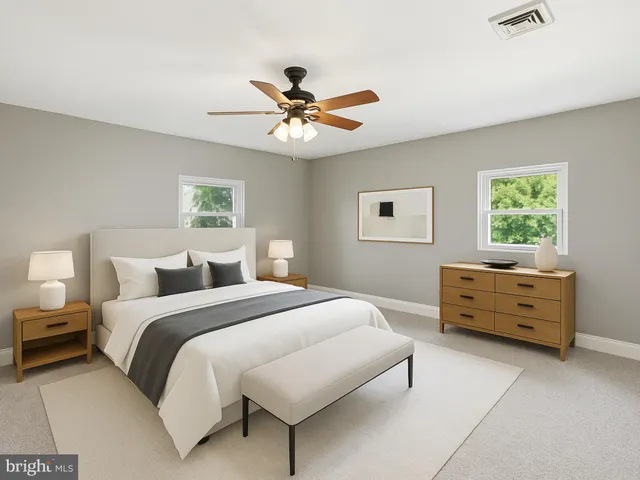 a bedroom with a bed and a dresser