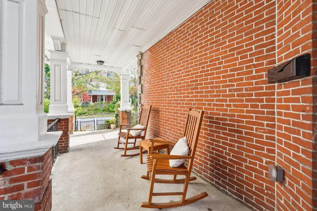 a view of a patio with table and chairs and potted plants