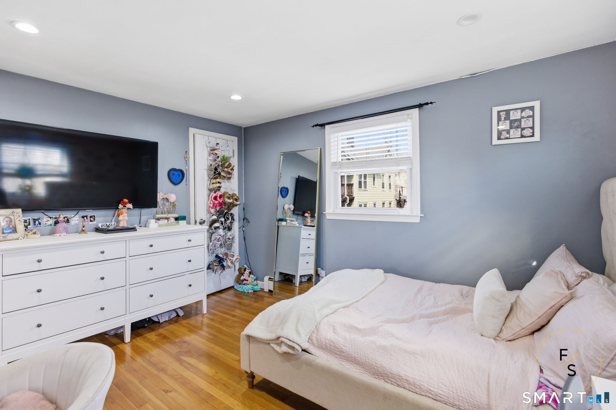 1 Phillips Street, Unit 4 Norwalk, CT 06850 - Photo 13 of 35 a bedroom with a bed and a flat screen tv