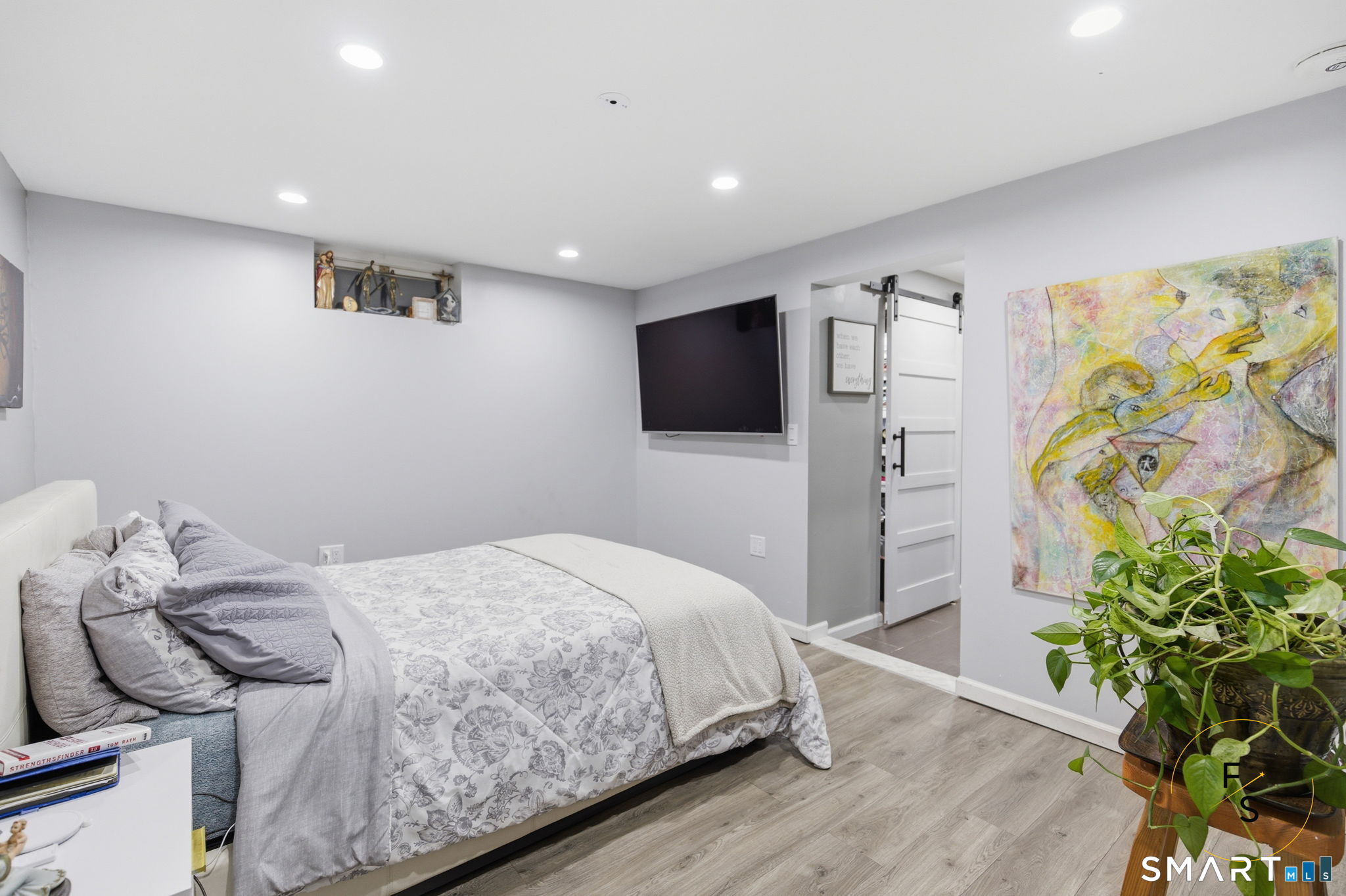 1 Phillips Street, Unit 4 Norwalk, CT 06850 - Photo 20 of 35 a bedroom with a bed and a flat screen tv