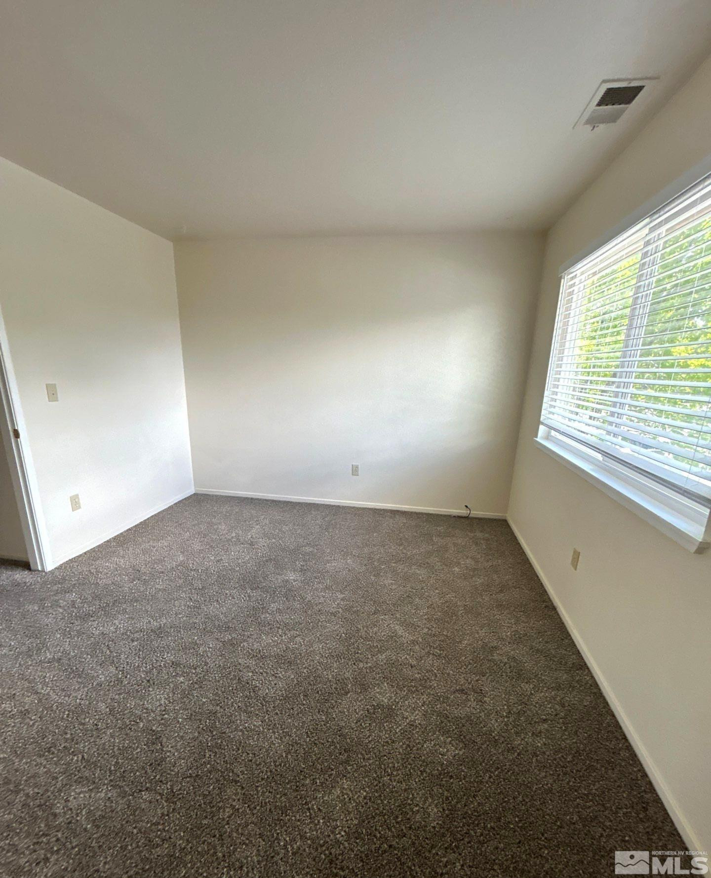 3673 Grant Drive, Unit C Reno, NV 89509 - Photo 11 of 15 an empty room with a window