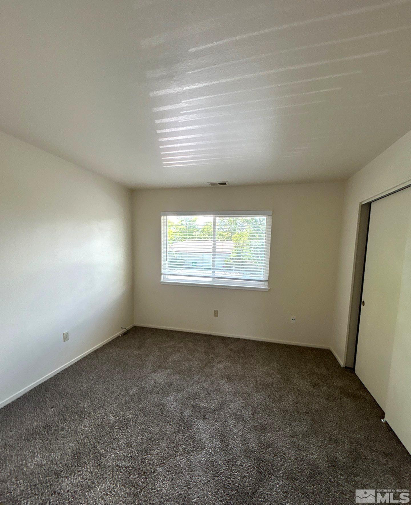 3673 Grant Drive, Unit C Reno, NV 89509 - Photo 12 of 15 an empty room with a window