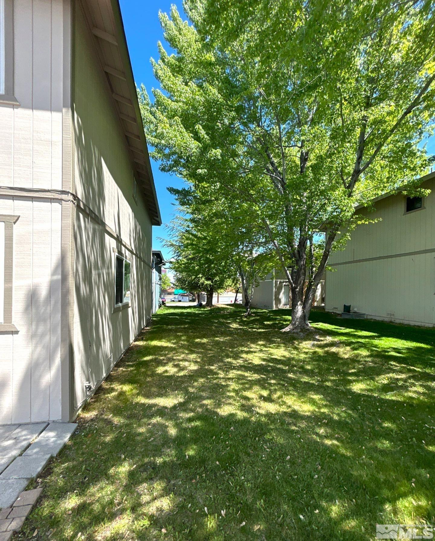 3673 Grant Drive, Unit C Reno, NV 89509 - Photo 15 of 15 a view of a yard with large trees