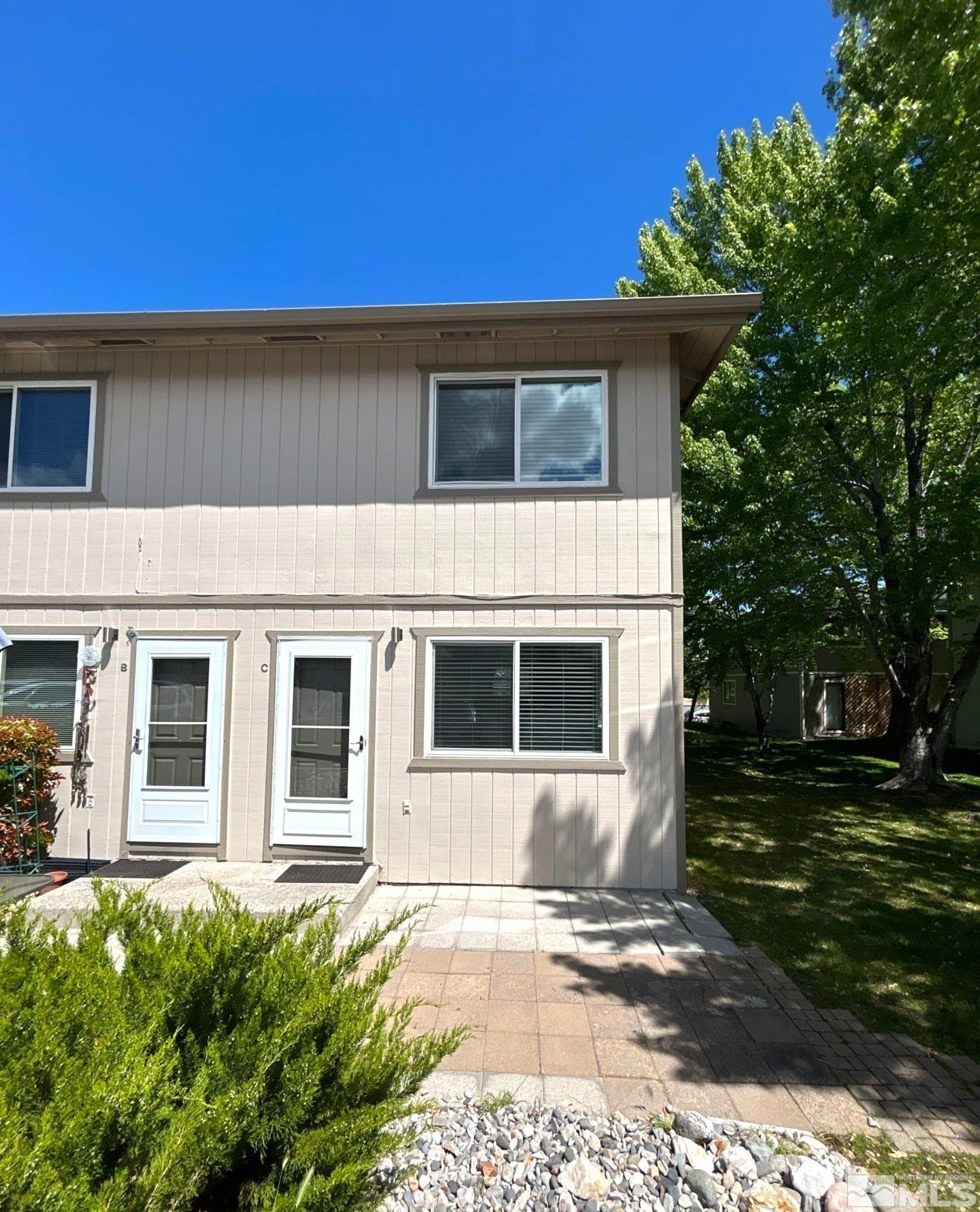 3673 Grant Drive, Unit C Reno, NV 89509 - Photo 2 of 15 a backyard of a house with plants and trees