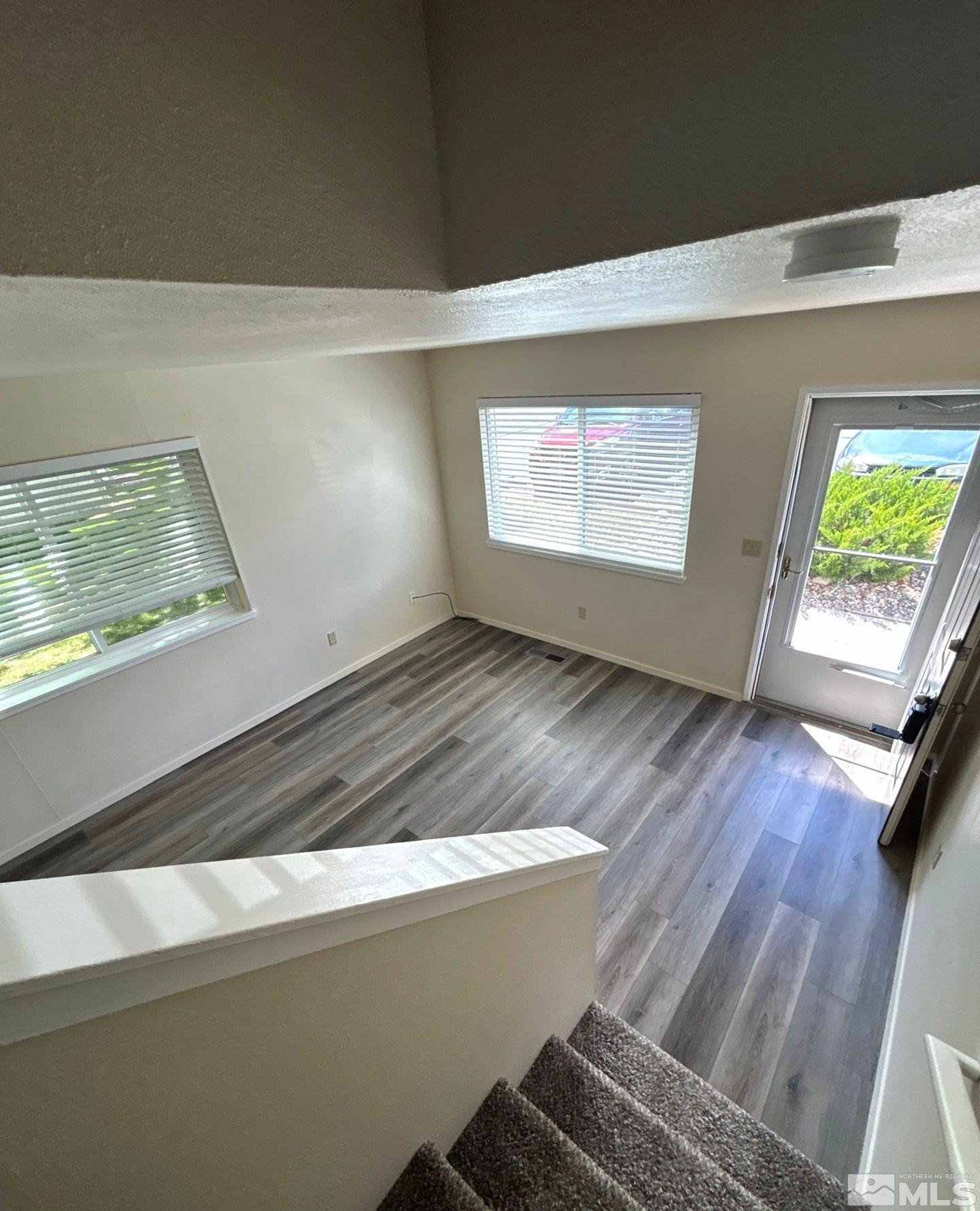 3673 Grant Drive, Unit C Reno, NV 89509 - Photo 8 of 15 a view of kitchen with wooden floor and window