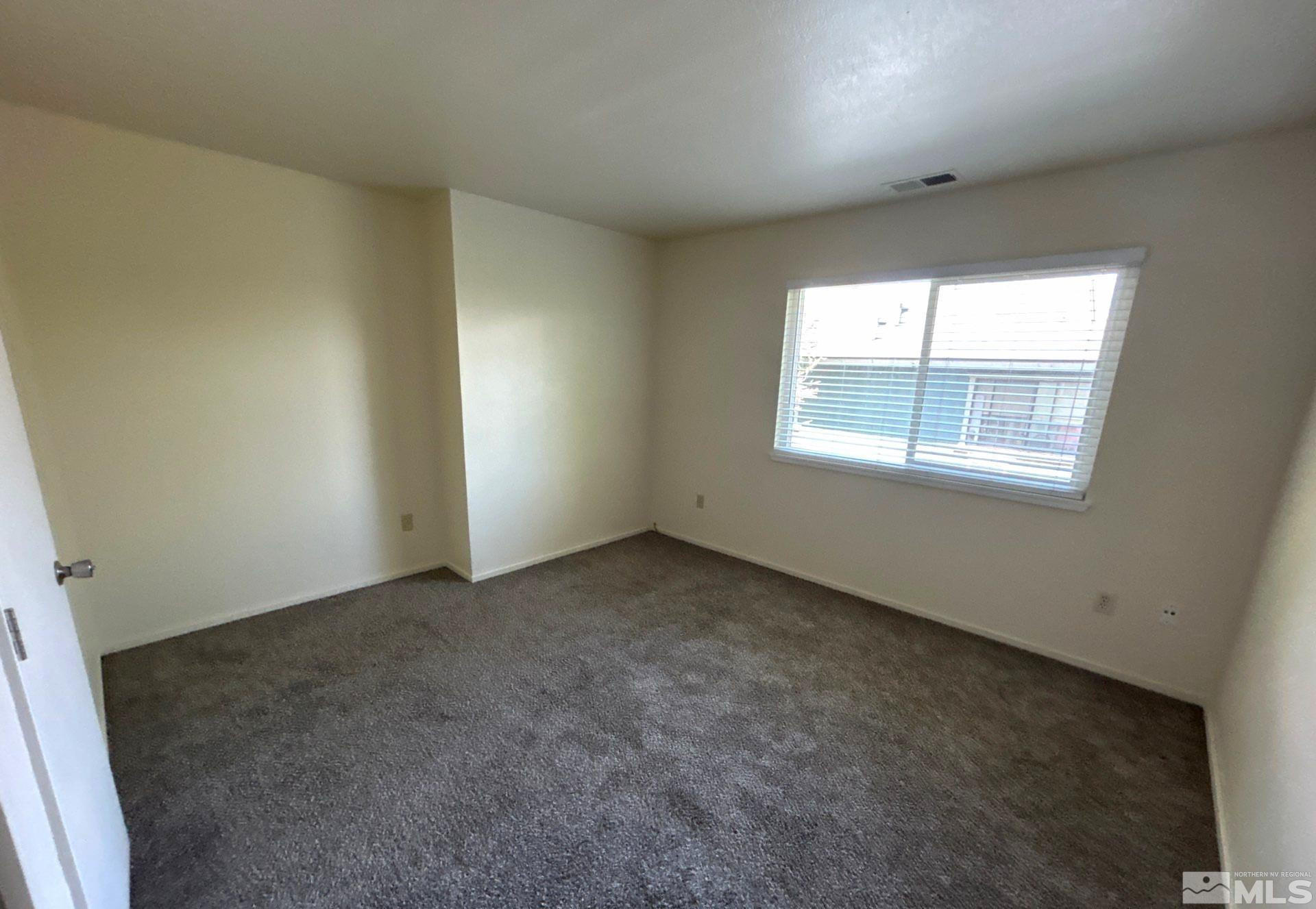 3673 Grant Drive, Unit C Reno, NV 89509 - Photo 9 of 15 an empty room with a window