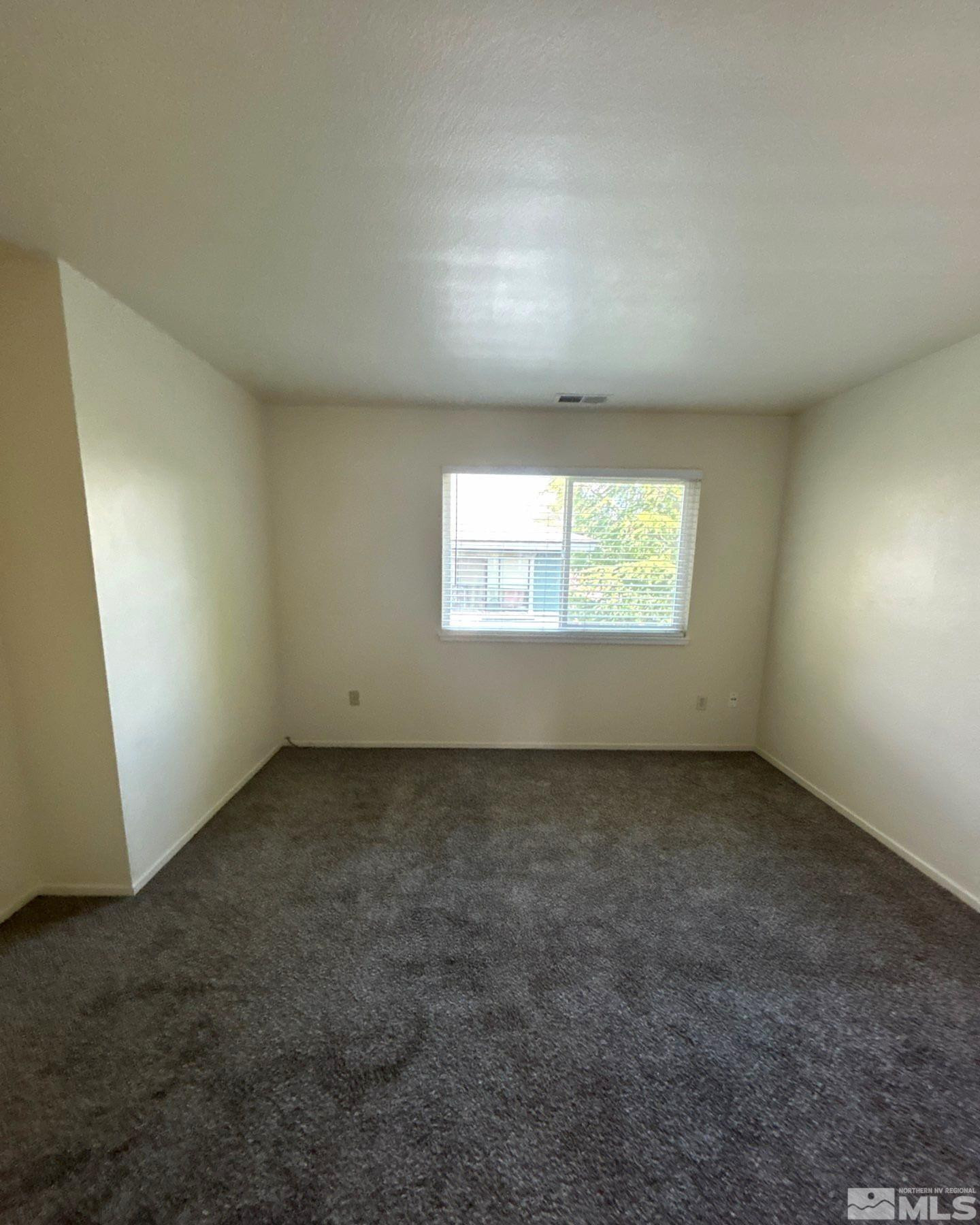 3673 Grant Drive, Unit C Reno, NV 89509 - Photo 10 of 15 an empty room with a window