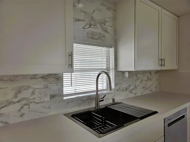 a close view of a stove a microwave and cabinets in the kitchen