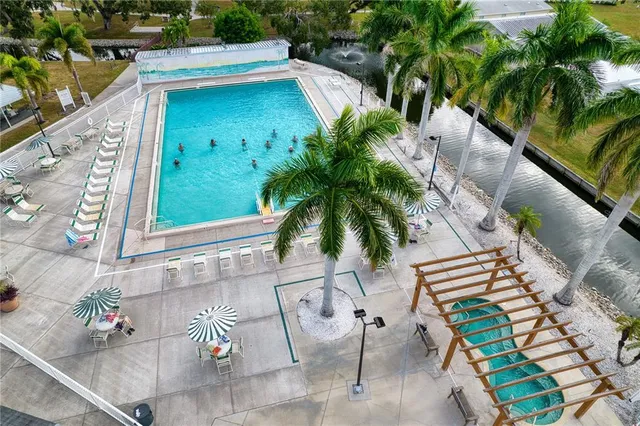 a view of a swimming pool with a yard