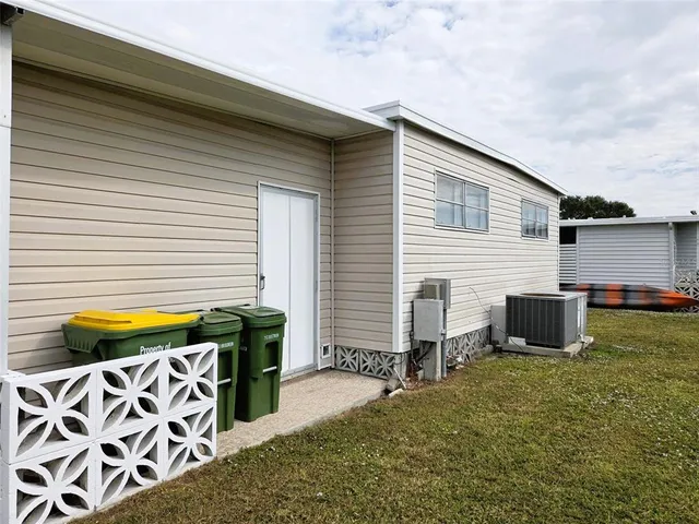 a view of a backyard with chairs