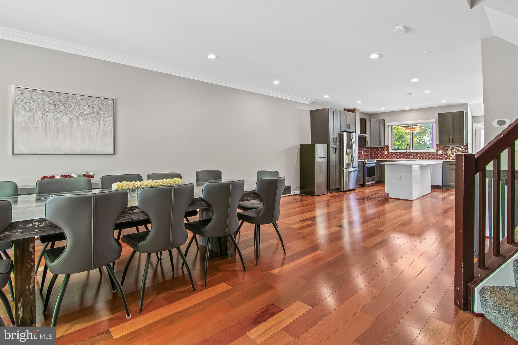 108 Lancefield Road Baltimore, MD 21209 - Photo 11 of 28 a view of a dining room with furniture and wooden floor