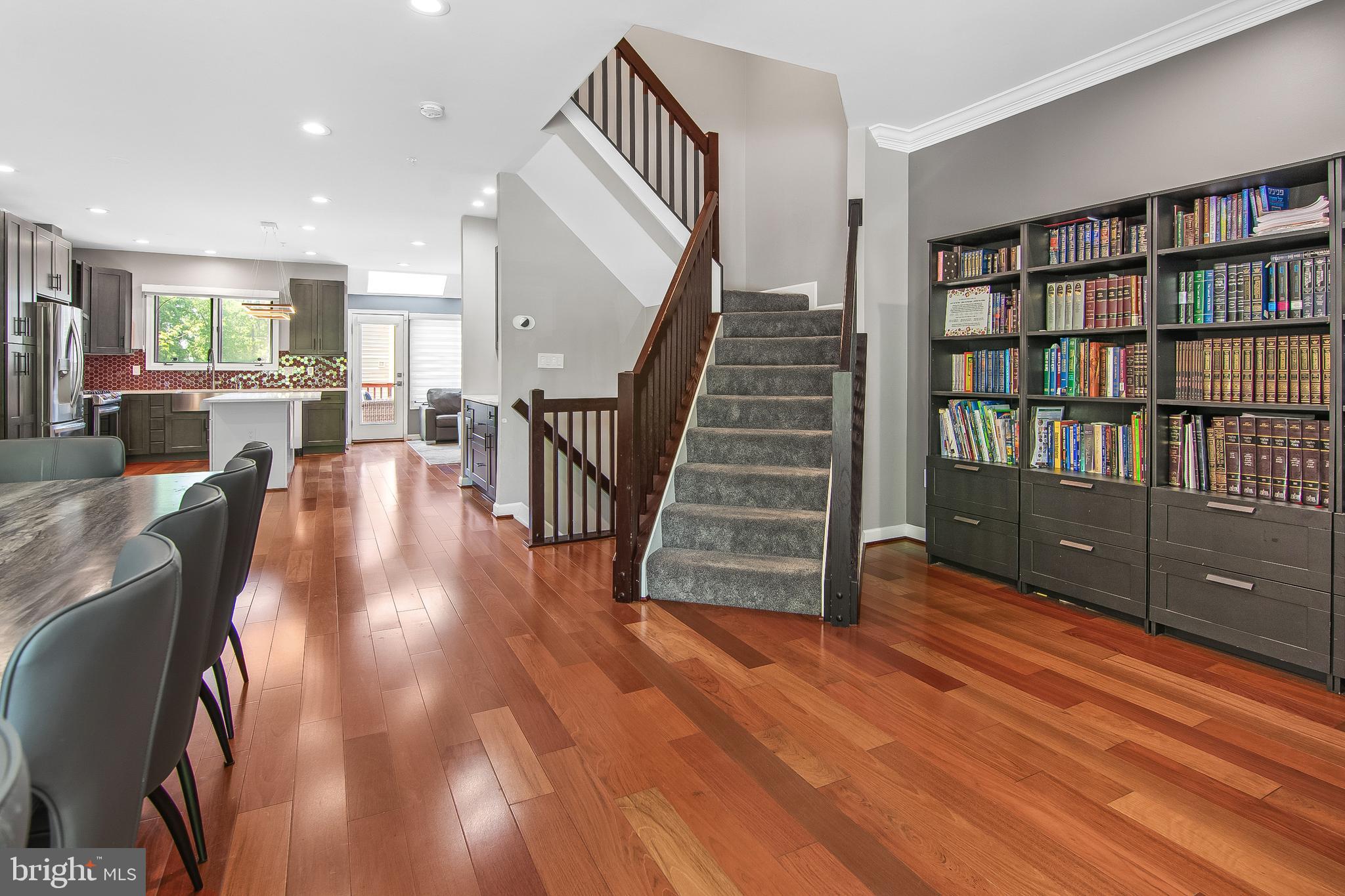108 Lancefield Road Baltimore, MD 21209 - Photo 12 of 28 a view of a living room with wooden floor and stairs