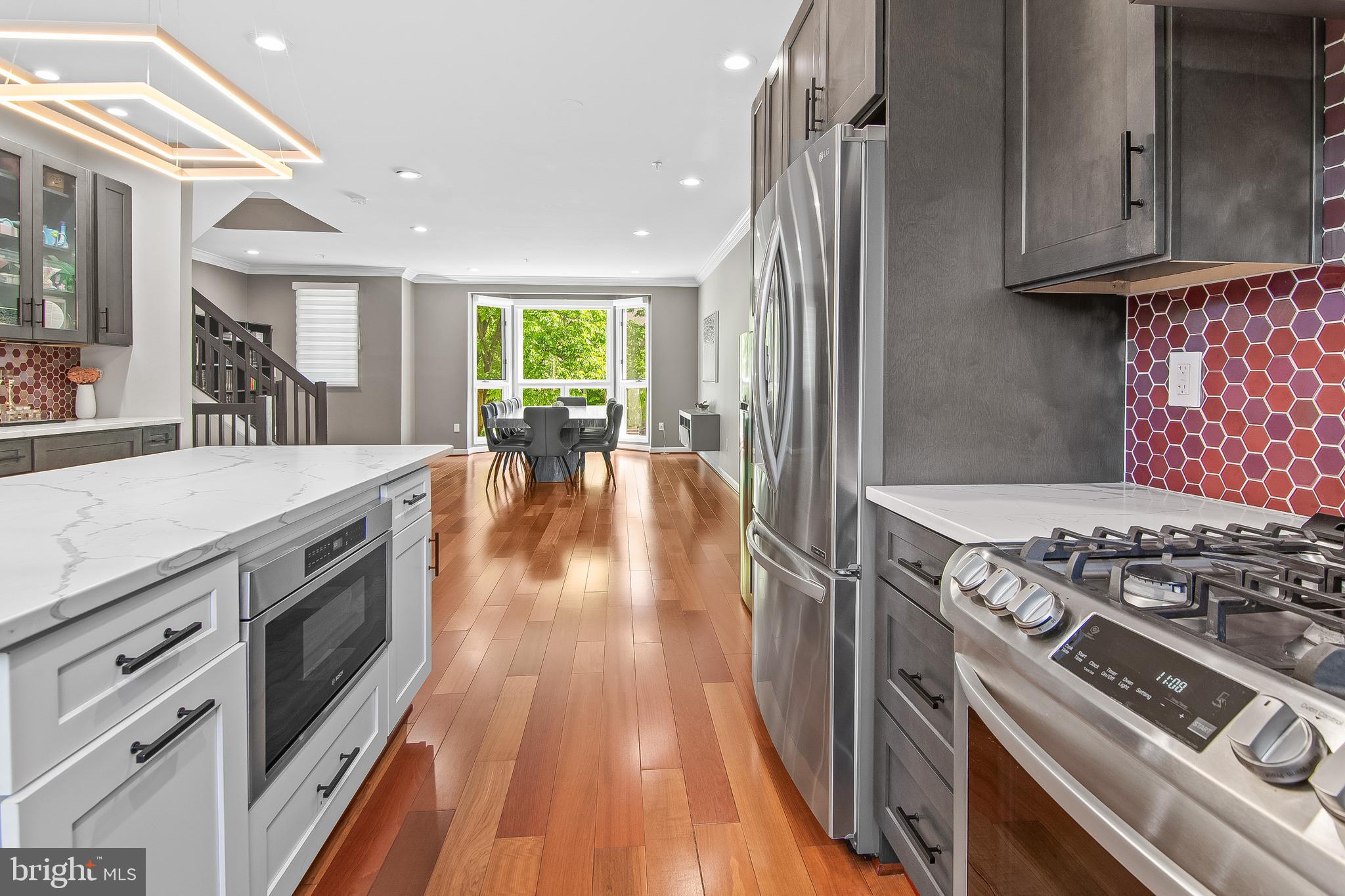 108 Lancefield Road Baltimore, MD 21209 - Photo 16 of 28 a kitchen with a stove and a wooden floors